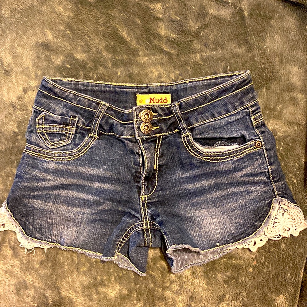 Girls Jean shorts with white fabric sewn on outside